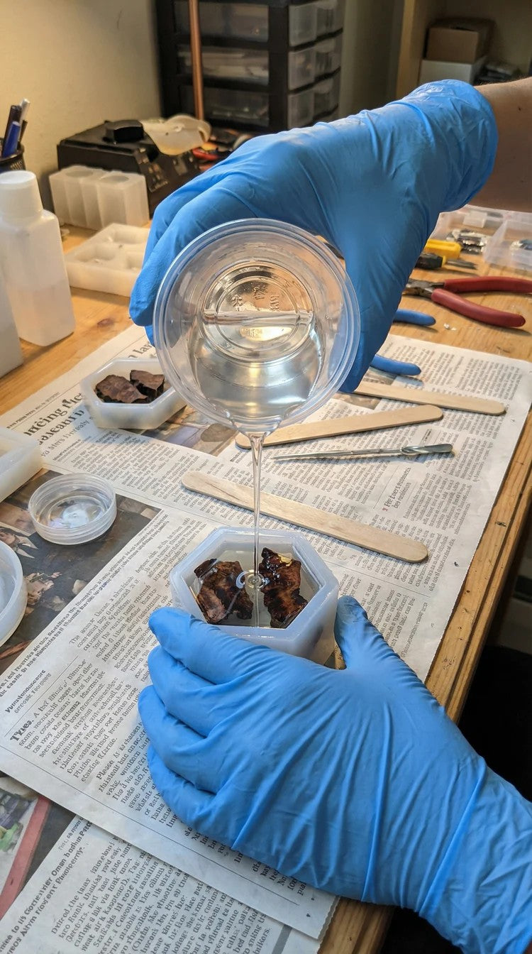 Clear resin being poured into a mold