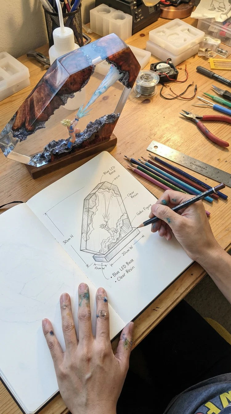 Design sketch and finished lamp on a workbench